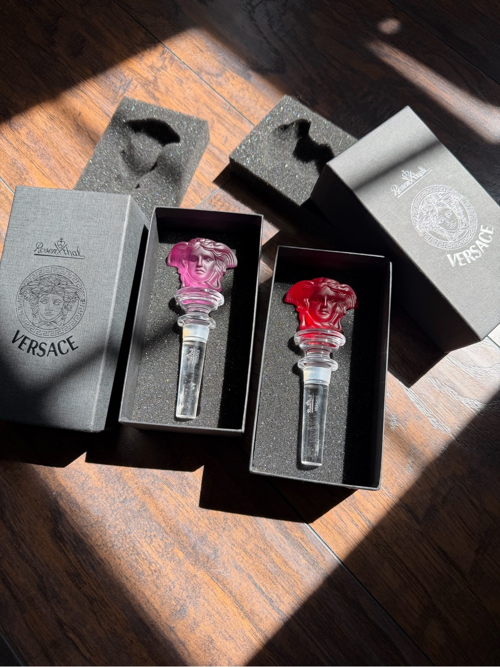 Versace Pair of Crystal Medusa Bottle Stoppers in Red & Amethyst Purple